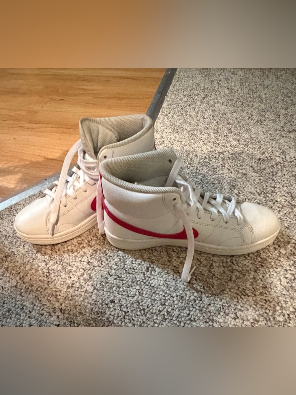 Nike White High-Top Sneakers with Red Swoosh Accent
